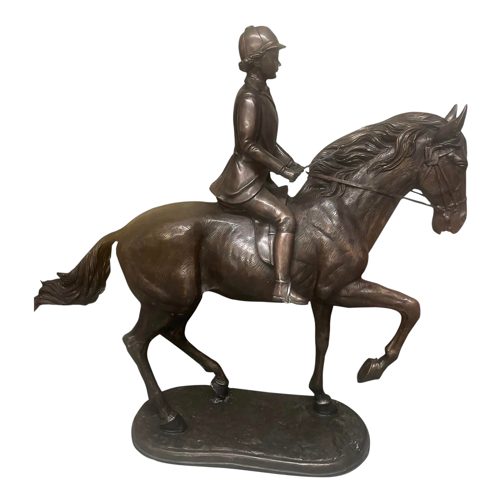Antique-Style Bronze Equestrian Sculpture of a Young Rider: This elegant bronze sculpture captures a moment of poised athleticism, featuring a young rider"”likely a boy in hunt or show attire"”astride a spirited horse. Rendered with fine attention 