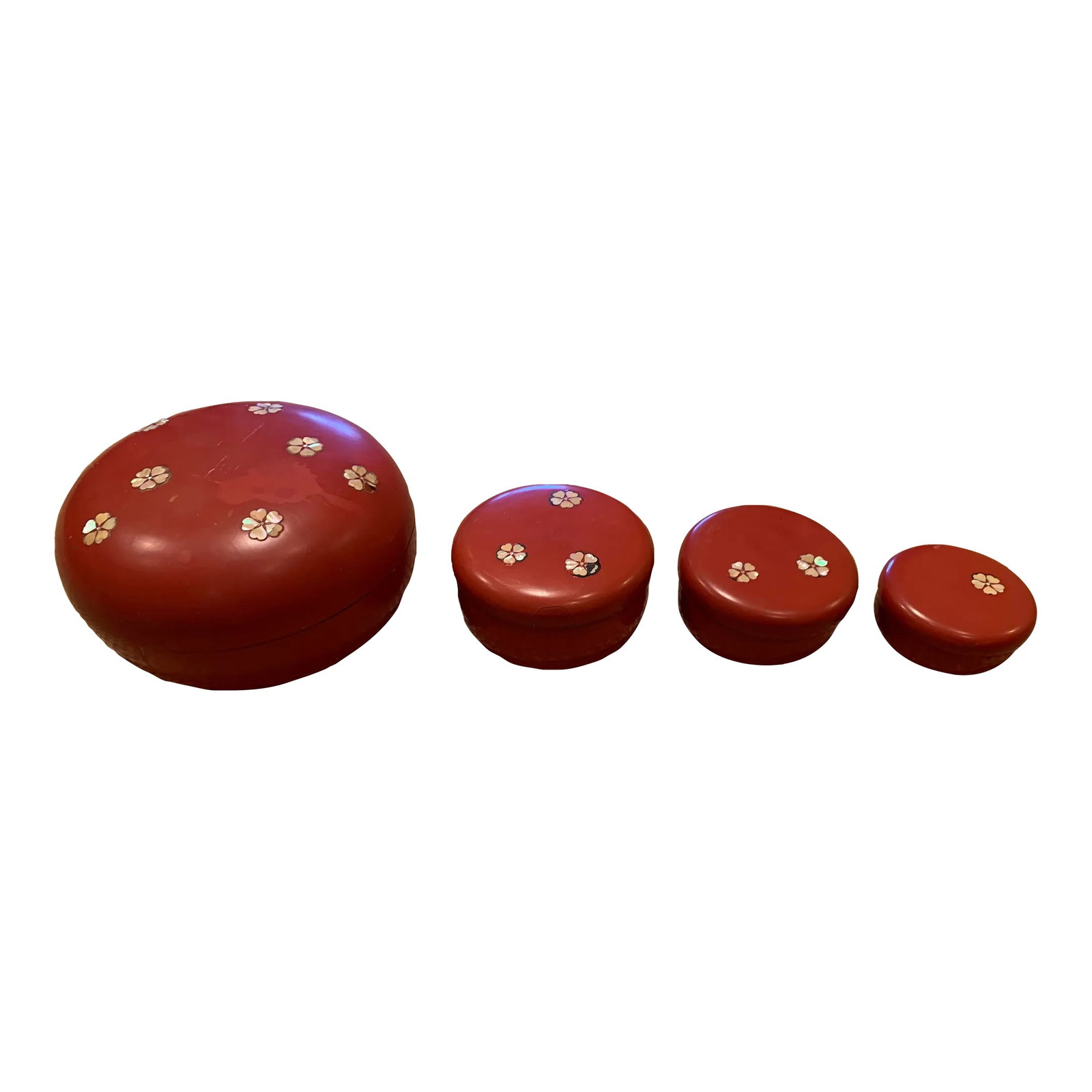 Vintage 1950s Japanese Nesting Bowls - Set of 4: Set of 4 Japanese red and black lacquer nesting bowls with mother of pearl inlay. Bowl Measurements: 7x7x5 4.5x4.5x2.5 4x4x2 3z3x1.5 Condition: Alterations: Original Condition Unaltered Imperfections: