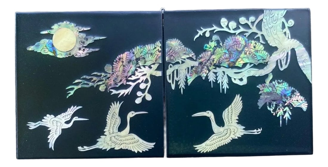 Late 20th Century Hollywood Regency Black Lacquer & Abalone Jewelry Cabinet: A finely crafted black lacquer jewelry cabinet featuring luminous mother-of-pearl inlay with elegant crane and moon motifs set among flowing pine branches and garden scenes. This smaller companion pie