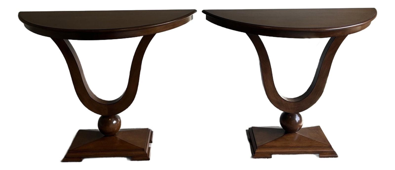 Pair of Attributed J. Alexander Sardinia Neoclassical Demi-Lune Console Tables: Elegant pair of J. Alexander "˜Sardinia' console tables featuring dramatic neoclassical lyre-form bases and demi-lune tops in a rich warm wood finish. These sophisticated consoles showcase beauti