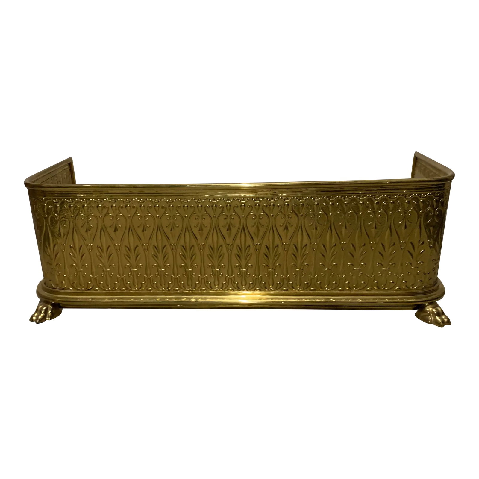 Vintage Art Deco Brass Fireplace Fender: Vintage Art Deco brass fireplace fender. The fireplace fender is an art deco style stamped brass on claw feet. Condition: Alterations: Original Condition Unaltered Imperfections: Some Imperfections Co
