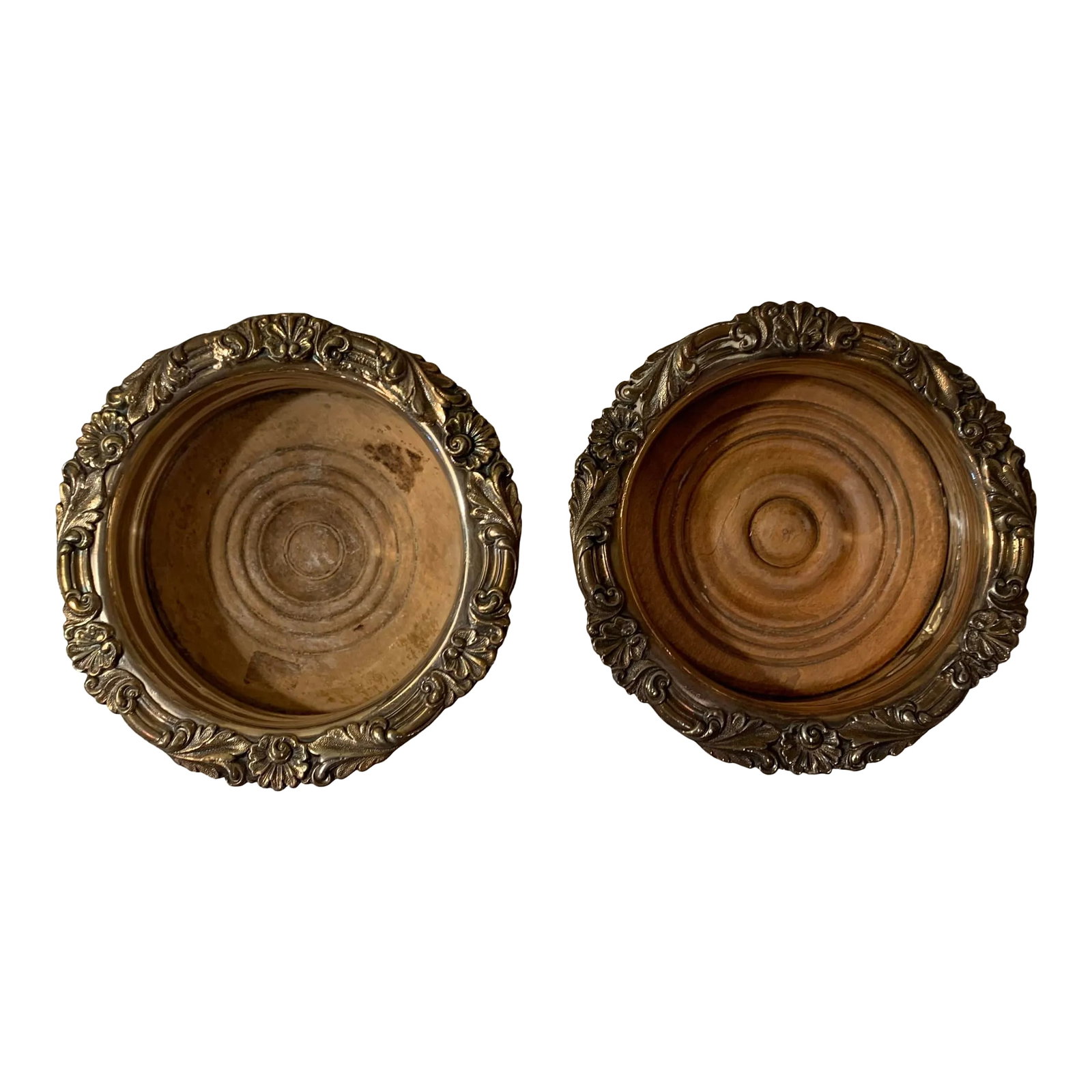 Antique Bottle Coasters- Set of 2: These Victorian style antique bottle coasters are unsigned, but presumed to have originated from England and date to approximately 1900. This bottle coaster is composed of silver plate and the rim is 