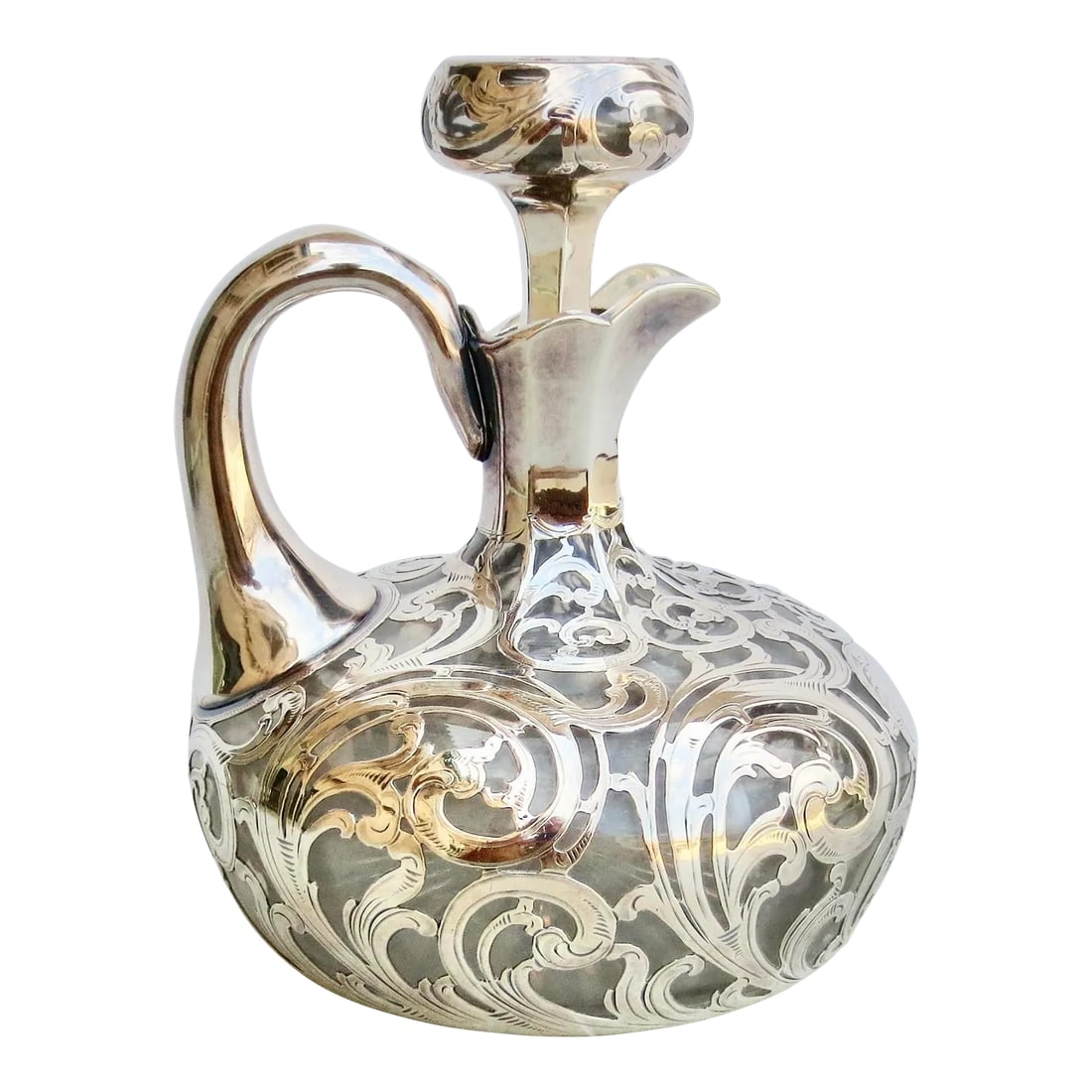 Antique Alvin Silver Overlay Decanter Circa 1890: Antique Alvin Silver overlay decanter with stopper. Circa 1880s-90s. cut crystal bottle with star-cut bottom fitted original stopper, and great weight. Brandy or aperitif ready. The surface is a conti