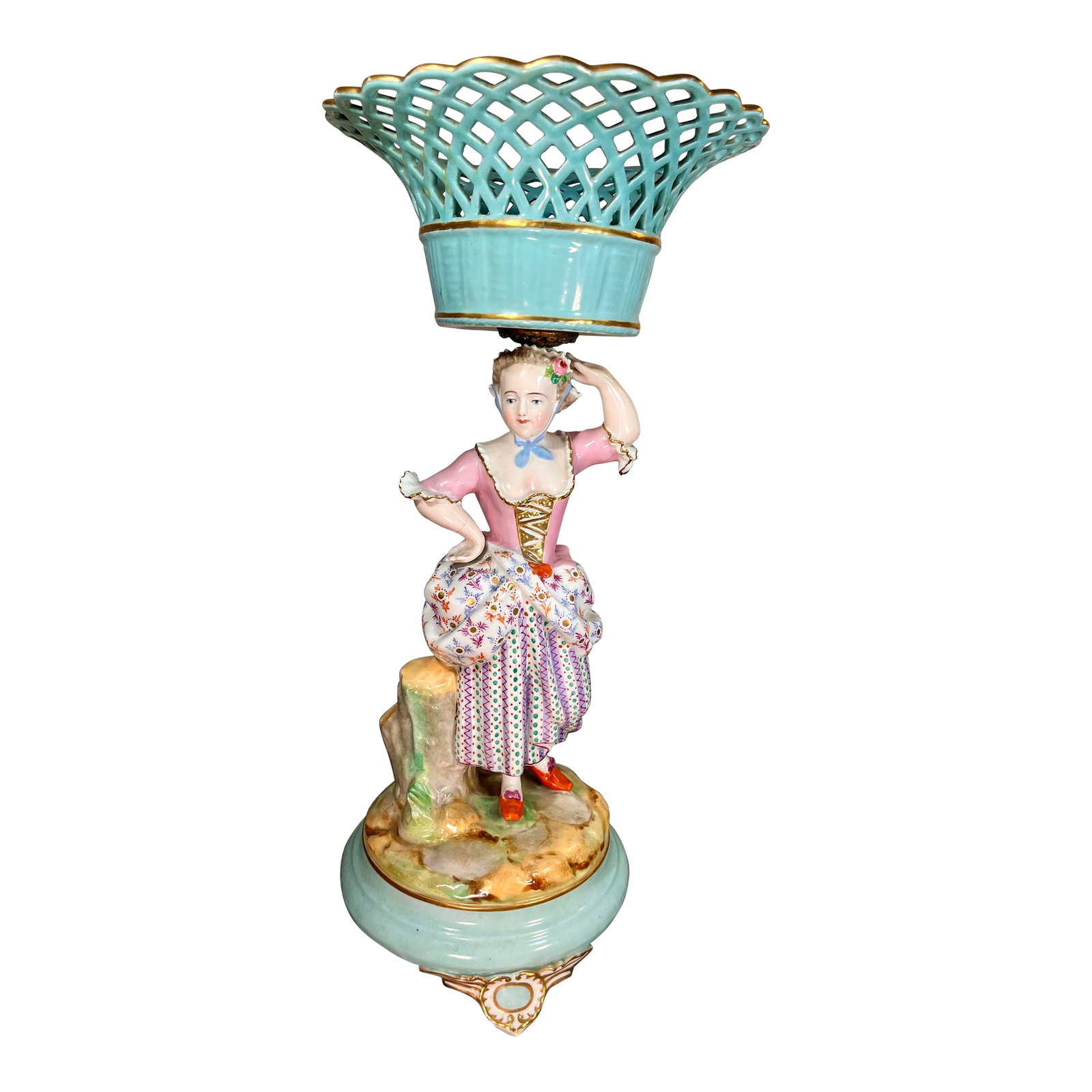 Antique Continental Porcelain Figurine With Reticulated Basket: Depicting a Lady, likely a shepherdess or noblewoman, carrying an open-weave basket on her head. Hand-painted porcelain with polychrome decoration and gilt accents. Condition: Alterations: Original