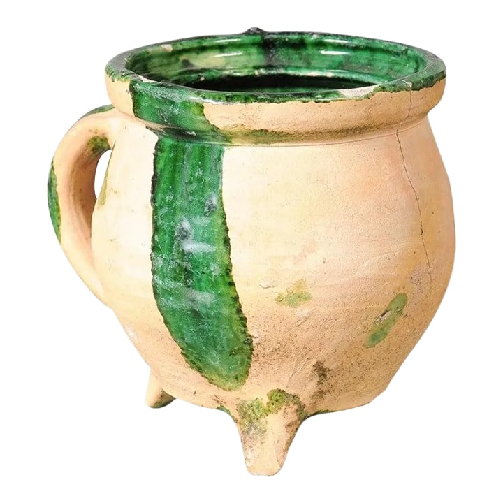 19th Century French Provincial Pottery Cooking Pot with Partial Green Glaze: A French Provincial spheroidal pottery cooking pot from the 19th century with green glazed accents, molded handle and tripod base. Created in Southern France during the 19th century, this pottery