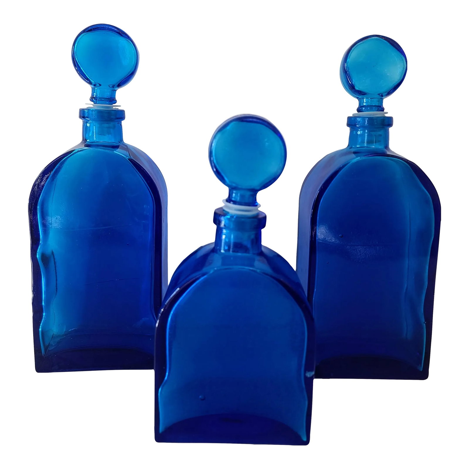 Set of 3 1970s Empoli Inspired Blue Lapis Decanter Bottles With Ball Stoppers: Beautiful vintage bottles that will inspire both the antiquarian or casual hobbyist. The wonderful tones of indigo and cobalt will brighten up a window sill, bookshelf or any favorite nook of your