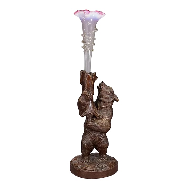 A Wooden Carved Black Forest Bear With Glass Vase Ca. 1900s: A Wooden Carved Black Forest Bear with Glass Vase ca. 1900s A finely carved standing Black Forest bear holding an Art Nouveau glass vase in his hands. Executed in Brienz, Switzerland, around 1900. Ver