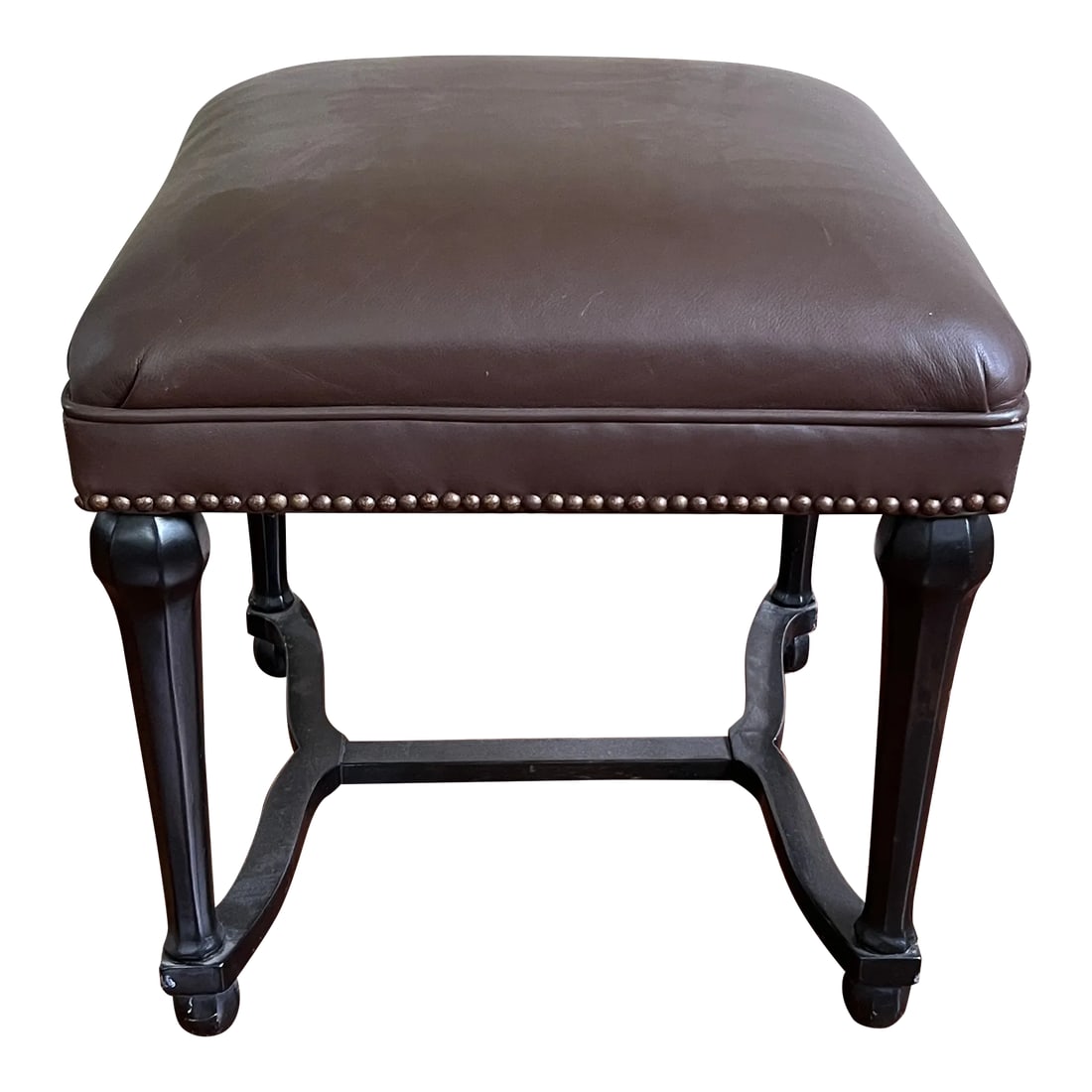 Vintage Baroque Style Bench: Elegant Brown Leather Upholstered Bench with nail head trim and ebonized legs. Condition: Alterations: Original Condition Unaltered Imperfections: Some Imperfections Condition Notes: Good condition