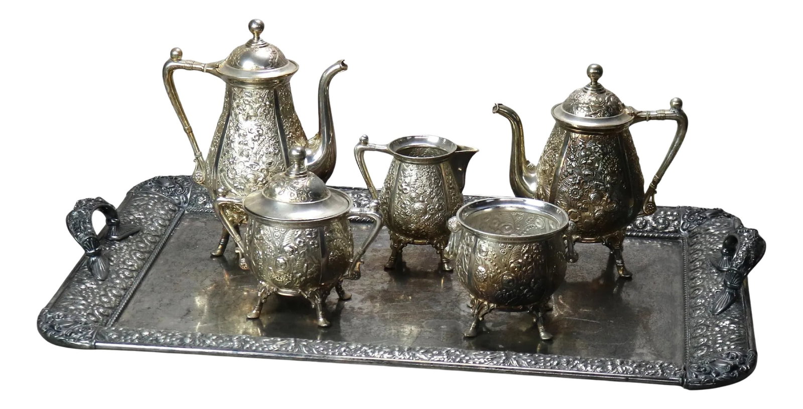 Circa 1890 Antique Silver Plated Floral Repousse Tea Set- 6 Pieces: Six-Piece Antique Silver Plated Floral Repousse Tea Set C1890 Waste Bowl - 5 1/4" x 5 7/8" x 5" Pitcher - 6 3/8" x 6" x 4" Large Pitcher - 10 1/8" x 9 1/4" x 5 1/4" Tray - 32 3/4" x 22" x 3 1/2" Cover