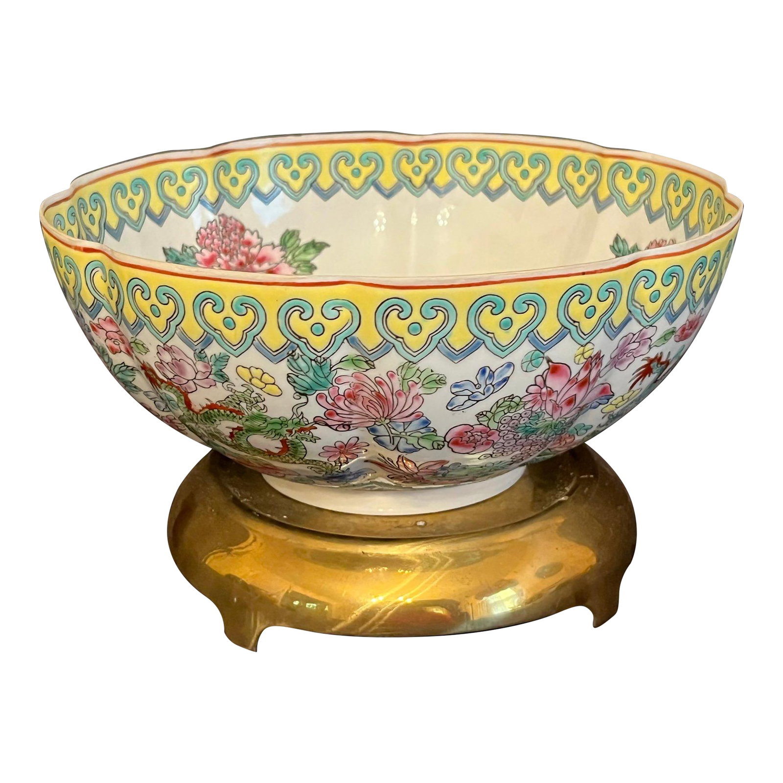 Early 20th Century Famille Rose Eggshell Porcelain Bowl With Brass Stand: A stunning early 20th-century Chinese Famille Rose porcelain bowl, delicately hand-painted with vibrant floral sprays, auspicious butterflies, and two vividly detailed dragons in traditional