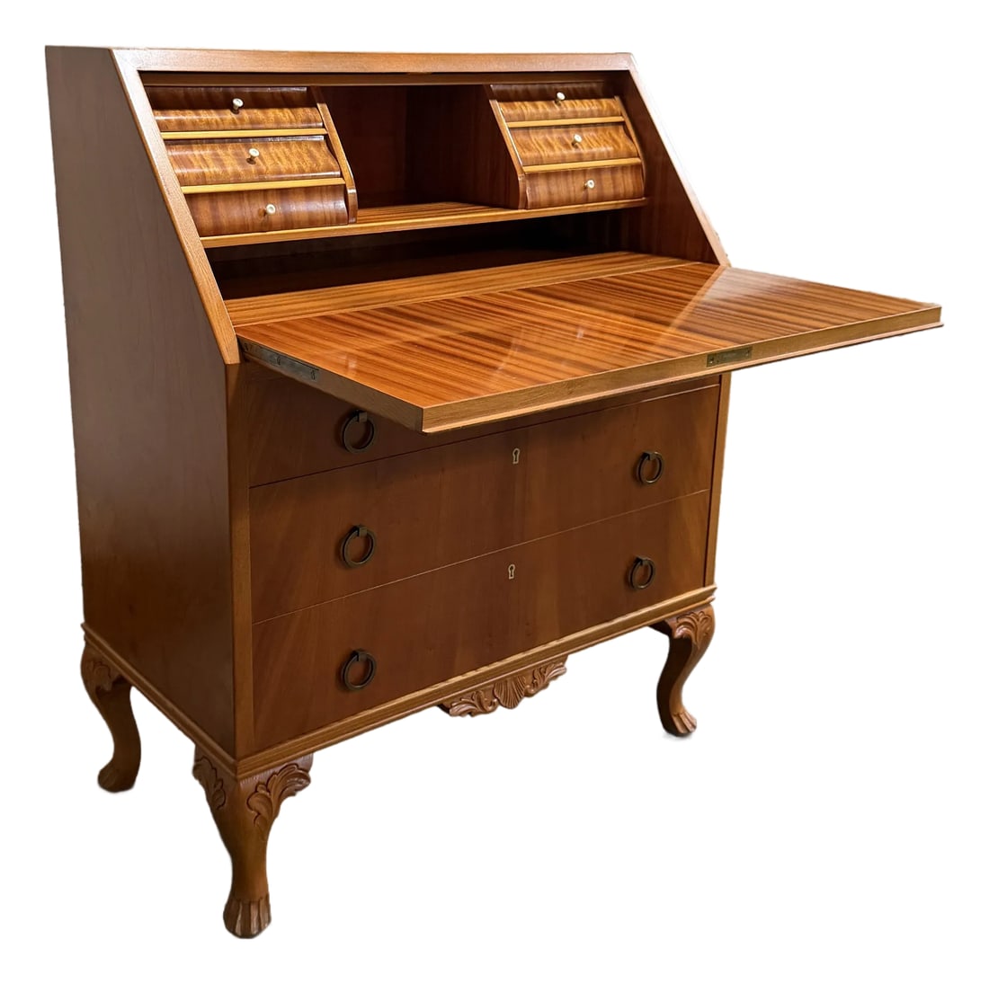 Vintage Swedish Drop-Leaf Secretaire Writing Desk C. 1950: Elegant drop-leaf secretaire writing desk crafted from golden elm and glowing ribbon mahogany with carved elm details, cabriole legs, Bakelite escutcheons, Bakelite interior drawers pulls and antique