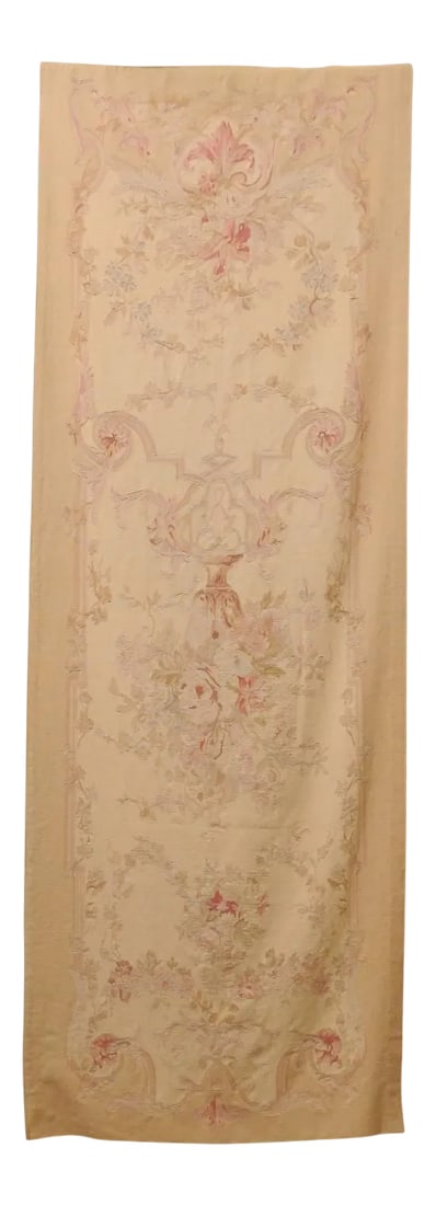 French 19th Century Vertical Hand-Woven Tapestry with Floral Décor and Volutes: A French handwoven vertical tapestry from the 19th century, with soft muted colors and floral décor, lined and backed with a hanging sleeve. This exquisite French tapestry features a tall