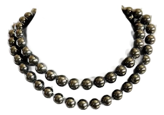 Mid 20th Century Long Onyx Necklace: Stunning 34" beaded onyx necklace. Each bead is the same size measuring a bold 12mm, with knots in between each bead for extra security. Can easily be doubled if you add your own favorite hoop