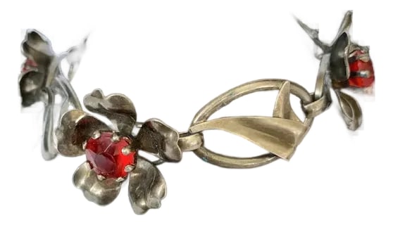 Mid 20th Century Sterling Floral Link Bracelet: Just in time for summer, a beautiful sterling silver floral link bracelet with red rhinestones in the center of each flower. The bracelet has three flower links and four open oval links with a