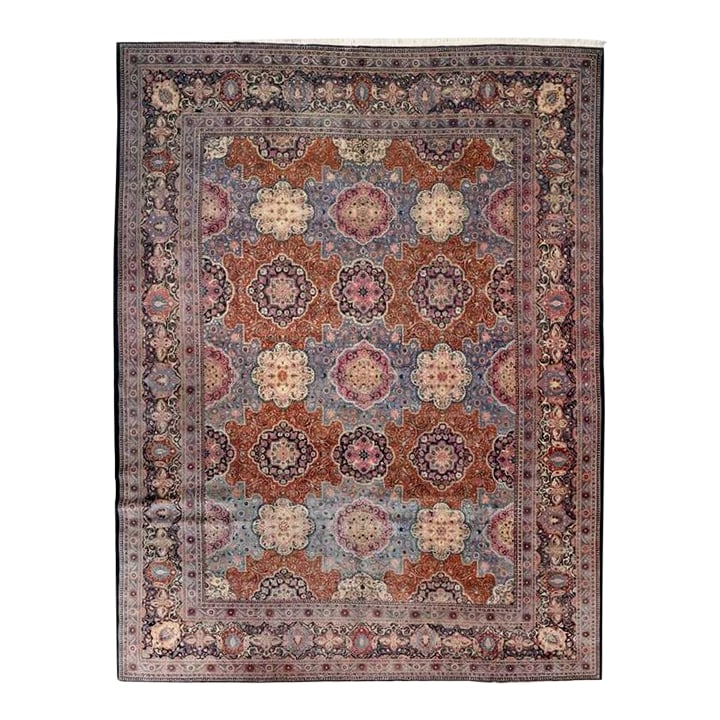 Antique Persian Dabir Kashan Rug 10'2" X 13'8": Antique Persian Dabir Kashan hand-knotted wool rug with a light blue field and an allover repeating medallion pattern composed of floral rosettes and stylized geometric forms. The field is enclosed