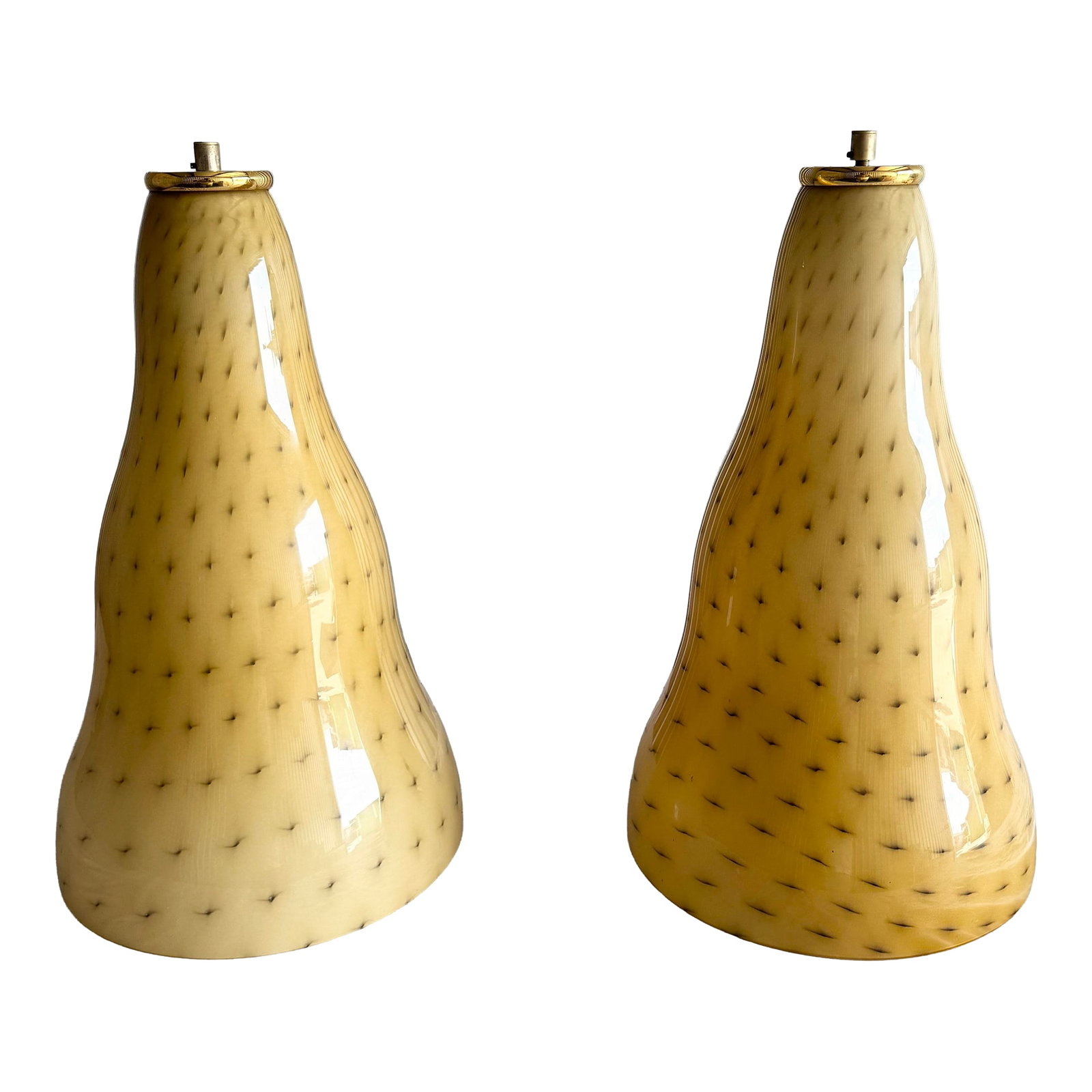 Vintage Italian Glass Pendant Lamps by Toso & Massari for Leucos - A Pair: A striking pair of vintage Italian pendant lamps by Toso & Massari for Leucos, showcasing the artistry of Murano glassmaking. Each shade features a fluid, organic silhouette in warm amber tones,