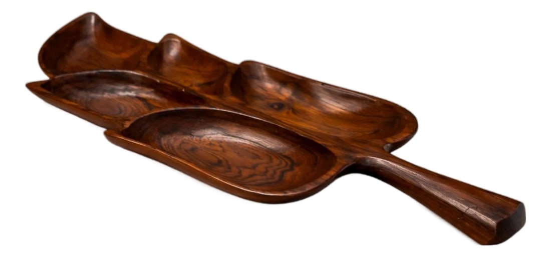 Brazilian Modern Serving Tray With Shape of Leaf in Rosewood, Unknown, 1960s: Carved from a single block of richly figured hardwood, this sculptural serving platter evokes the organic contour of a tropical leaf. The elongated form unfolds into three gently recessed compartments