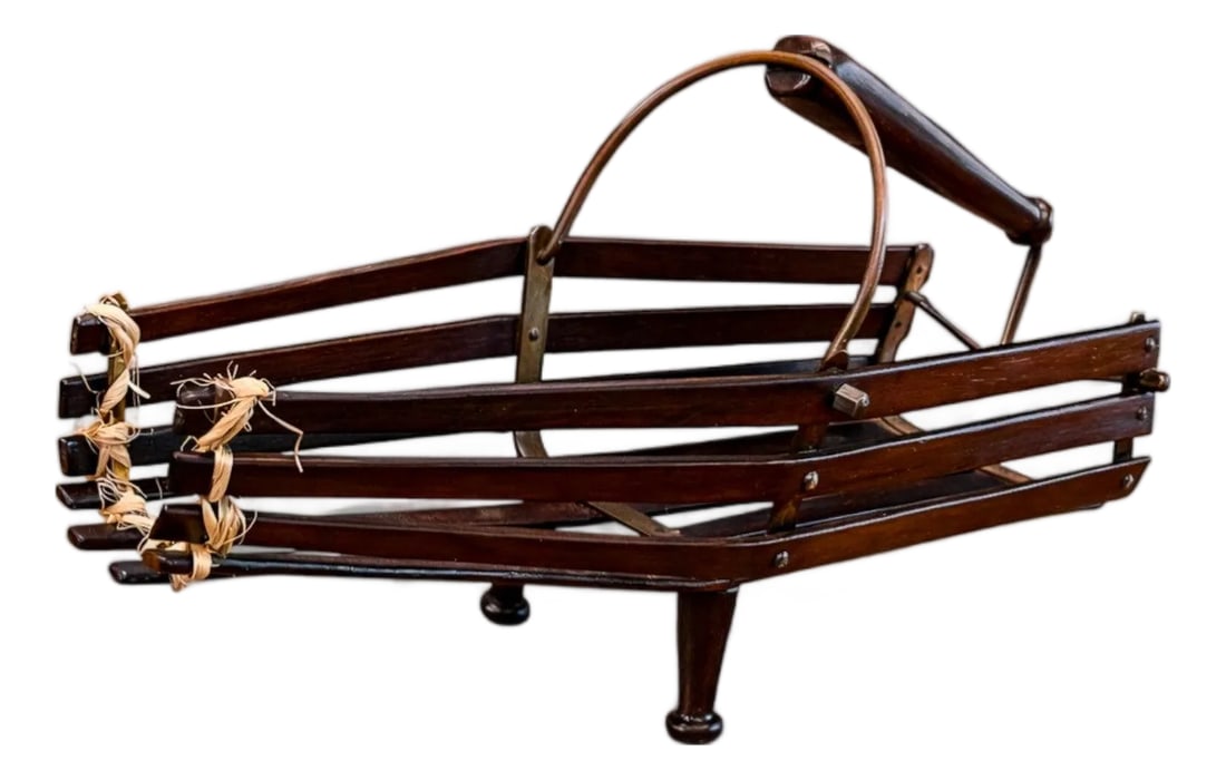 1960s Wine Holder in Rosewood & Metal, Unknown: Attributed to a mid-20th century workshop, this sculptural wine holder reflects a utilitarian object resolved with structural clarity. The inclined form is defined by horizontal hardwood slats that ex