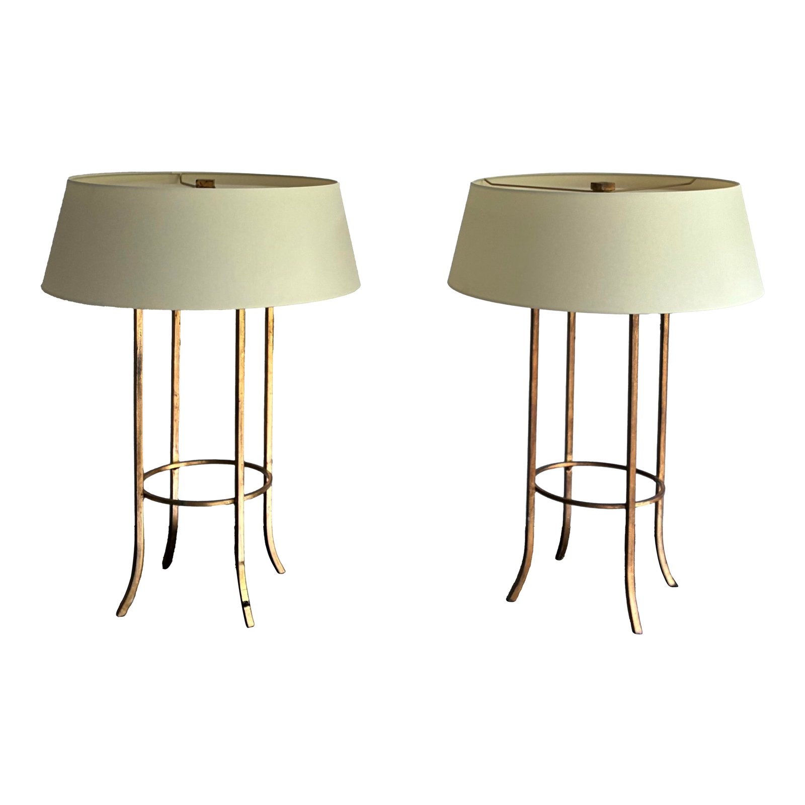 Late 20th Century Pair of Baker Milling Road Gold Cage Table Lamps: Elegant pair of designer table lamps by Baker Furniture for the Milling Road collection, featuring a refined open cage form in a warm antiqued gold finish. The minimalist sculptural bases are
