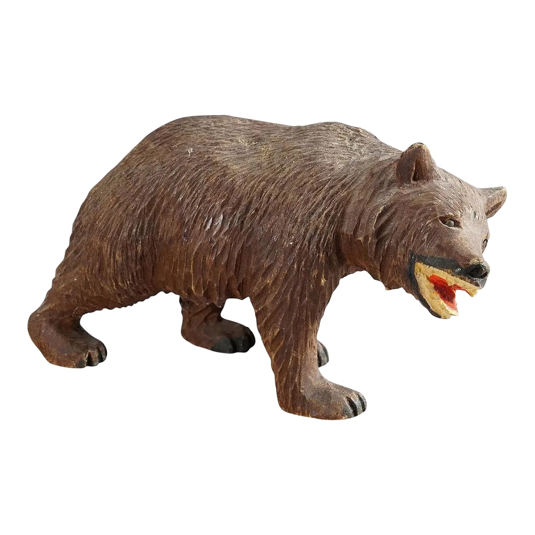 Vintage Wooden Strolling Bear Handcarved in Brienz Ca. 1950: Vintage Wooden Strolling Bear Handcarved in Brienz ca. 1950 A vintage statue of a walking bear. Made of lindenwood, finely handcarved with naturalistic details in Brienz, Switzerland ca. 1950. A nice
