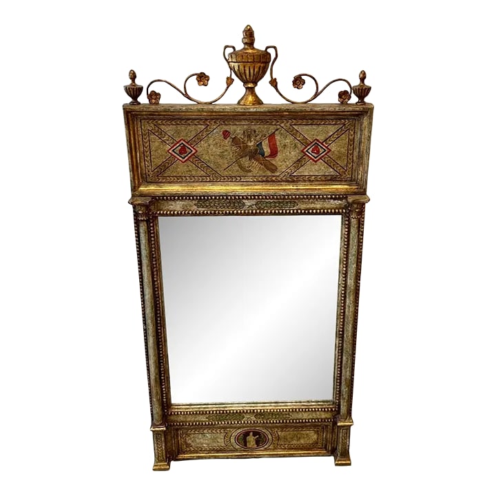 Italian Neoclassical Style Hand Painted Mirror With Aged Glass: Superbly hand painted and gilded neoclassical style mirror having wonderful old world feel with urn decoration at the top and gorgeous details such as a flag painted on the frame as well as a statuesq