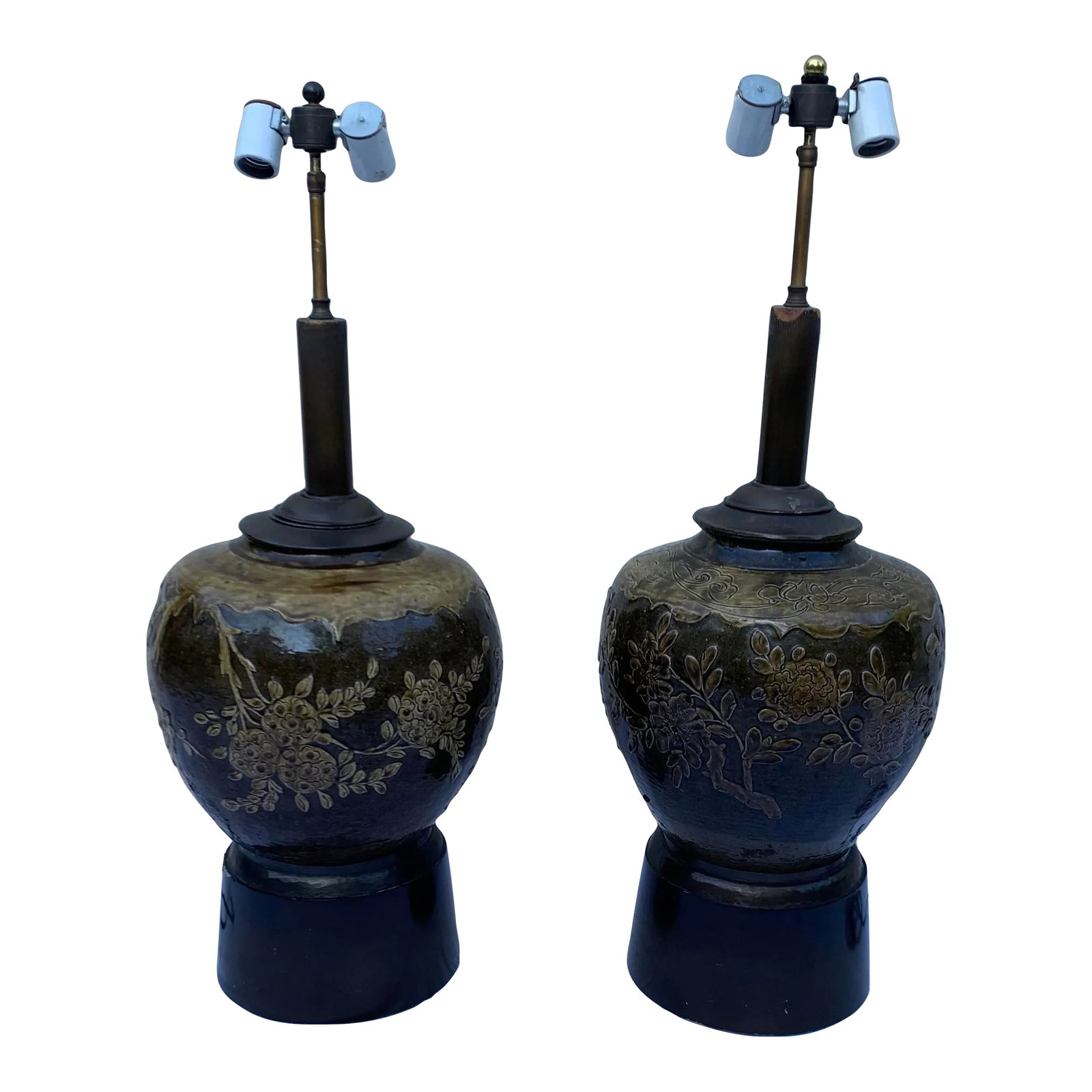 Vintage Late 20th Century Handcrafted Urn Table Lamps, Set of 2: Pair of vintage urn glazed clay jar lamps adorned with intricate vine motifs.. Mounted on wood base and includes double sockets plus a push thumb switch located at the back of the wood base. Condition