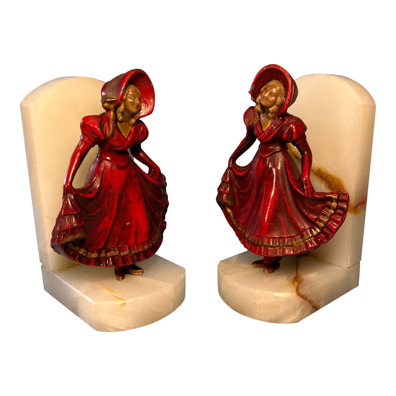 Vintage J. B.Hirsch Ivorine Alabaster Spelter Girl Curtsying Bookends- a Pair: These vintage bookends are a charming creation by the J.B. Hirsch company, showcasing both artistic craftsmanship and historical charm. Crafted from spelter, a metal alloy often used in decorative