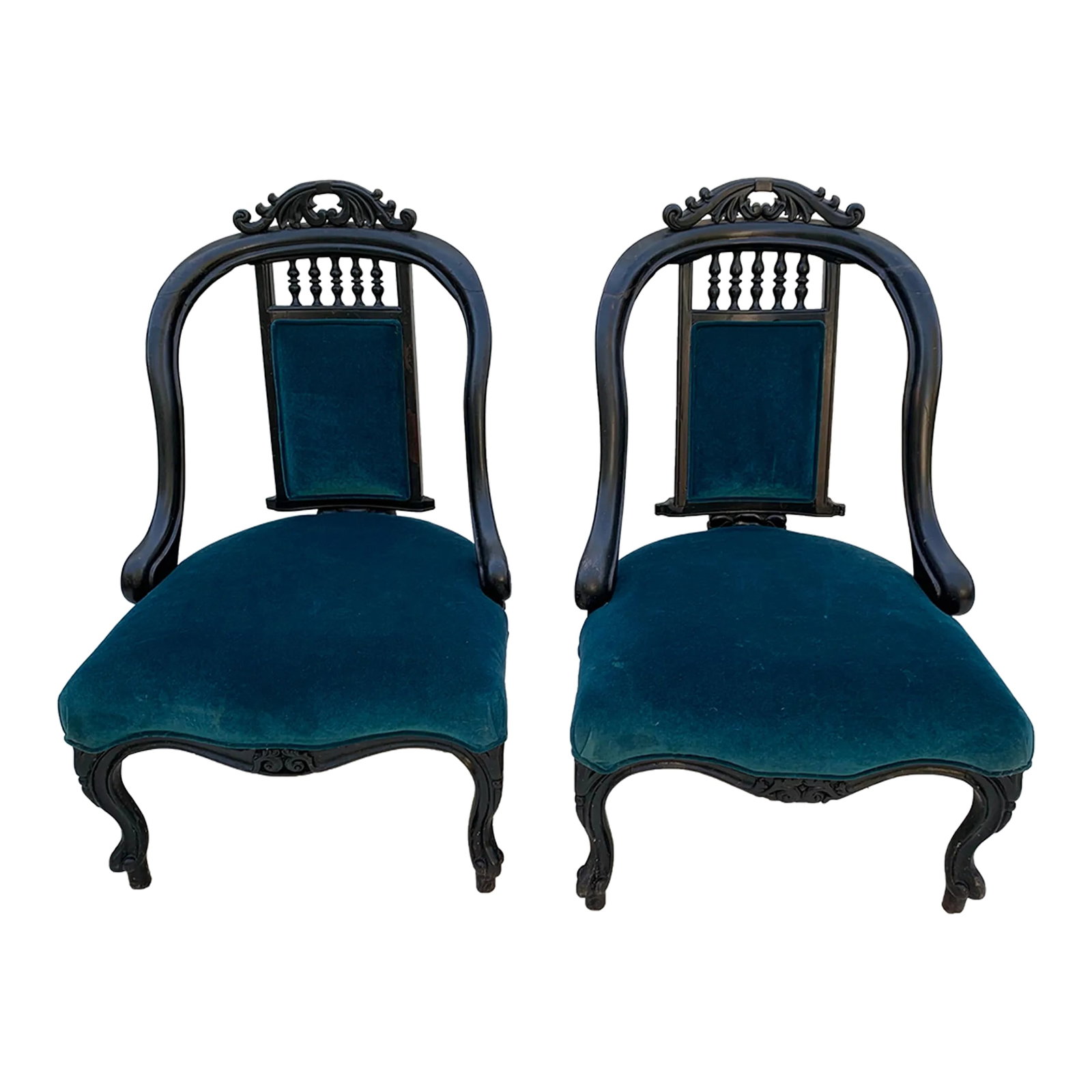 Early 20th Century Victorian Hand Carved Wood Framed Chairs With Blue Velvet Upholstery- a Pair: Antique rosewood armchairs influenced by the california arts and crafts movement. Wood doweling. Carved lily pattern detail. Upholstered in blue velvet Condition: Alterations: Original Condition