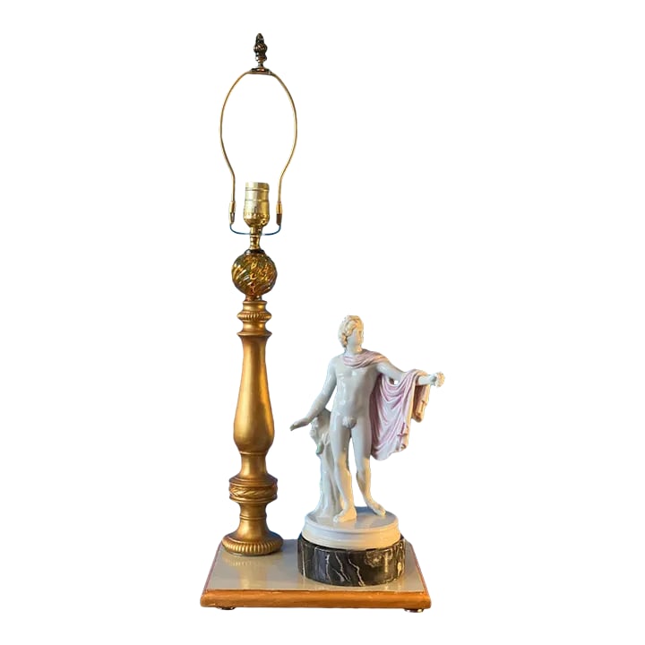 Vintage Kister Scheibe-Alsbach Porcelain Apollo Belvedere Porcelain Table Lamp: This exquisite porcelain figurine, crafted by the A. W. F. Kister Porcelain Manufactory of Scheibe-Alsbach, Thuringia, Germany, in the early 20th century, is a masterful homage to classical art. It