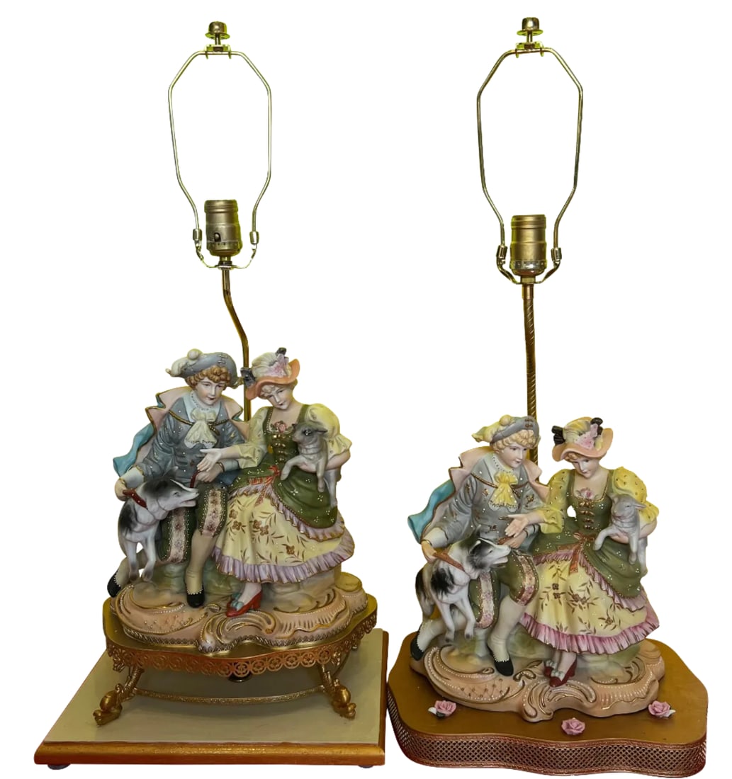 Vintage Bisque Figurine Table Lamp: Siblings Sitting With a Lamb and Dog: A Pair: These beautifully crafted bisque figural table lamps, made in mid-century Japan, draw inspiration from renowned porcelain companies like Meissen and Grafenthal. Each lamp features charming figures of 