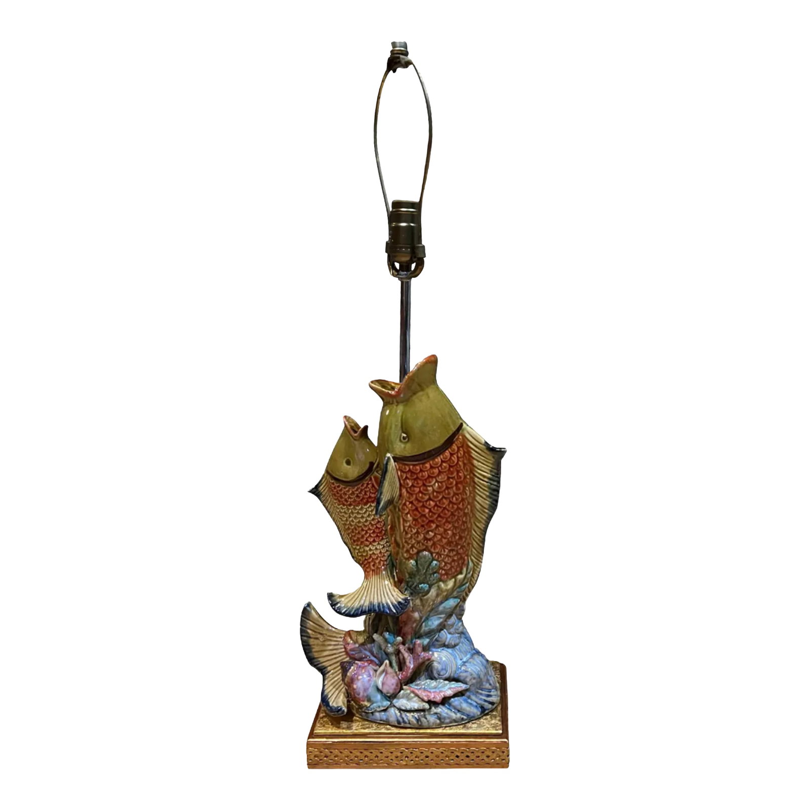 Majolica Leaping Fish Coral Table Lamp: This unique table lamp showcases a handcrafted pottery coy fish design, with one larger and one smaller fish depicted in the midst of swimming toward the surface. The base color is a mustard-colored g