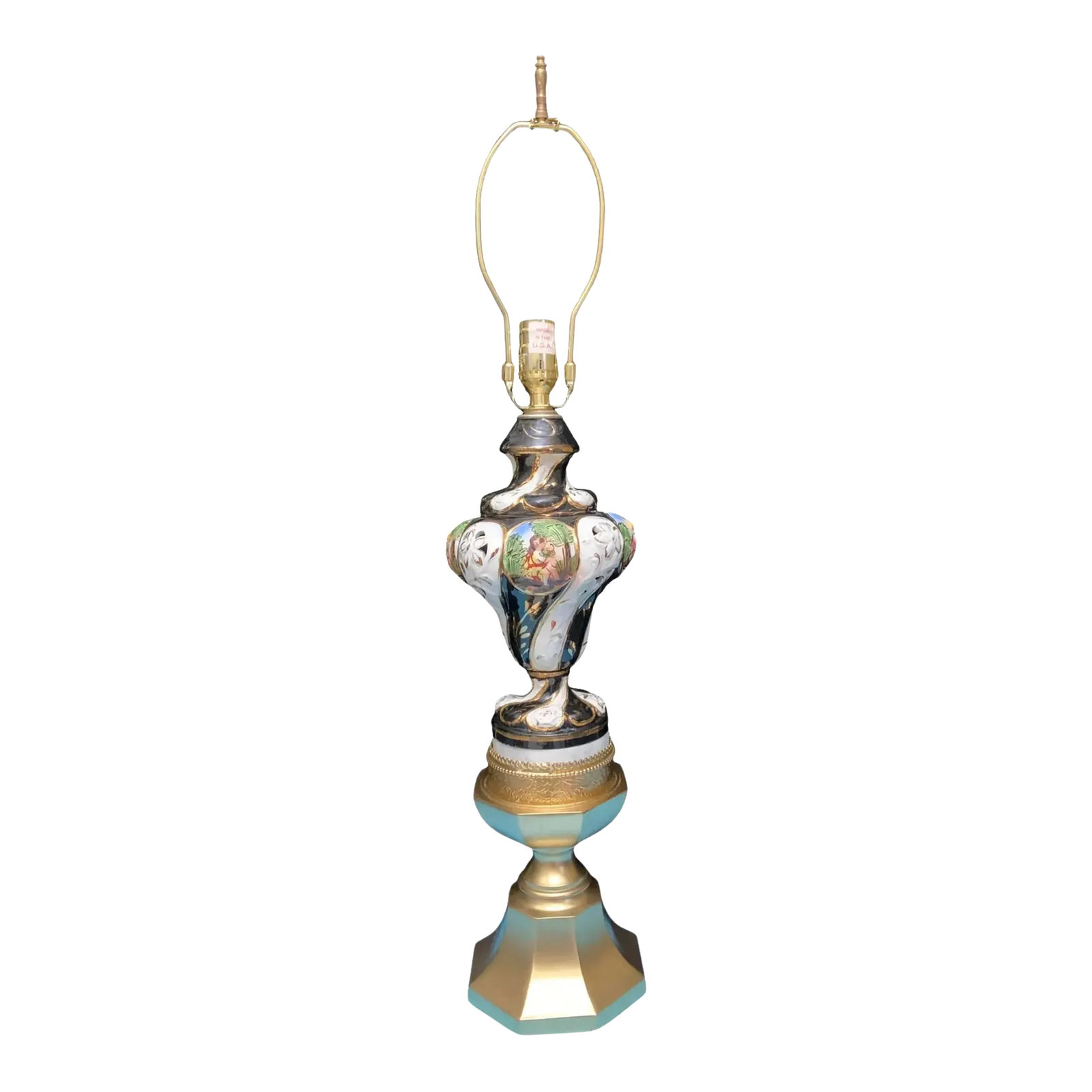 Capodimonte Porcelain Cherub Table Lamp: This unique lamp was crafted from a combination of vintage lamp parts, with each element carefully selected to create a one-of-a-kind piece. At its core lies a Capodimonte porcelain body, made and