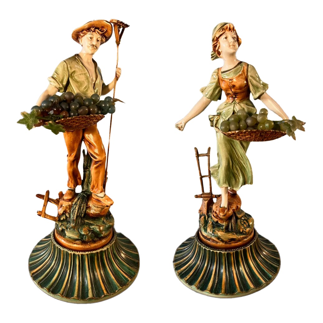 Moreau Spelter Sculpture Grape Harvesters Couple-A Pair: This exquisite pair of 14 inch tall sculptures from the Collection FranÃ§ais by the J.B. Hirsch Company is a rare and historically significant find. Crafted using the original molds of