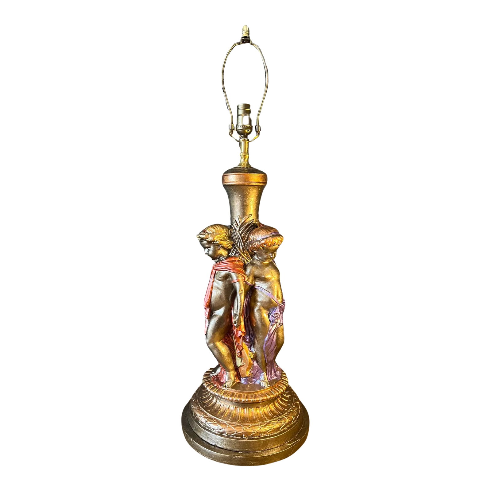 Mid-Century Trio of Cherubs Table Lamp: This remarkable Quartite chalkware table lamp features a trio of cherubs, each standing closely together in a delicate circle, their backs gently leaning against a classical column. The cherubs are