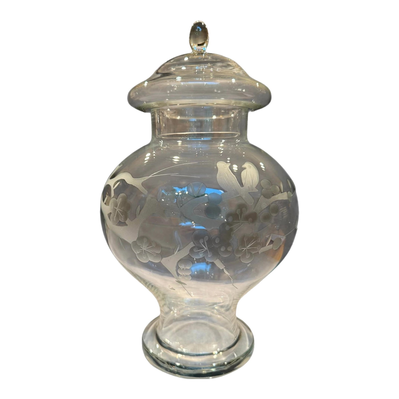 1950s Glass Ginger Jar With Etched Cherry Blossom Birds Motif: Offered is a gorgeous chinosserie-style 1950s clear glass ginger jar. This exquisite piece details an etched ornate scene of a pair of birds perching on a cherry blossom branch. Removable lid. 12.25"