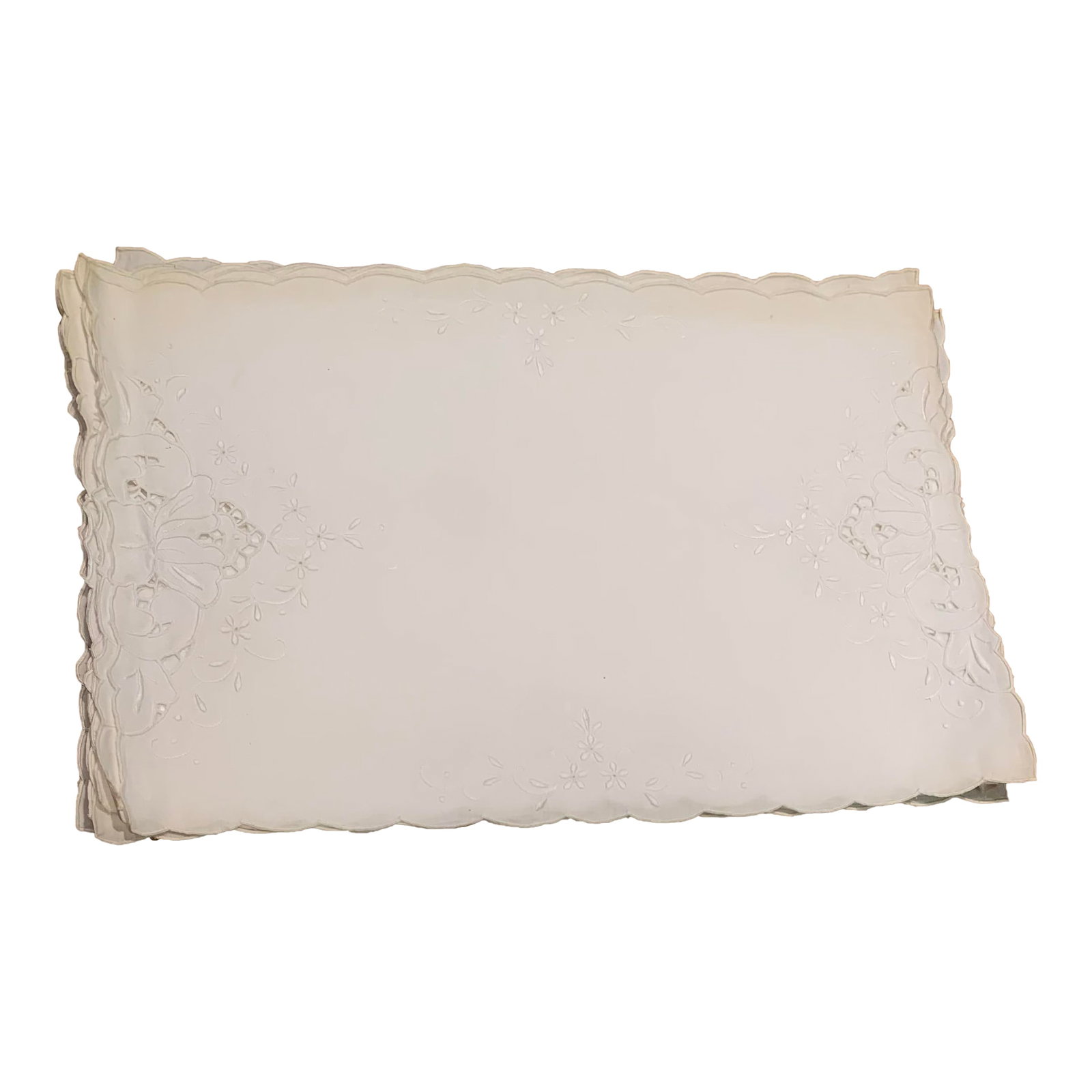 20th Century White Embroidered Cotton Placemats- Set of 4: Rectangular cotton white placemat with scalloped edges. It has embroidered floral patterns in the corners, set of 4. Condition: Alterations: Original Condition Unaltered Imperfections: Some
