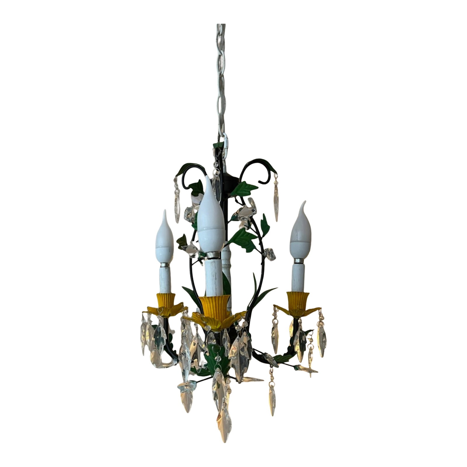 Tole Floral and Crystal 3 Light Chandelier: This hand-painted toleware chandelier, composed in a graceful three-candle silhouette, evokes the quiet elegance of a blooming garden. Each bobeche, shaped like a delicate yellow daffodil, lends a