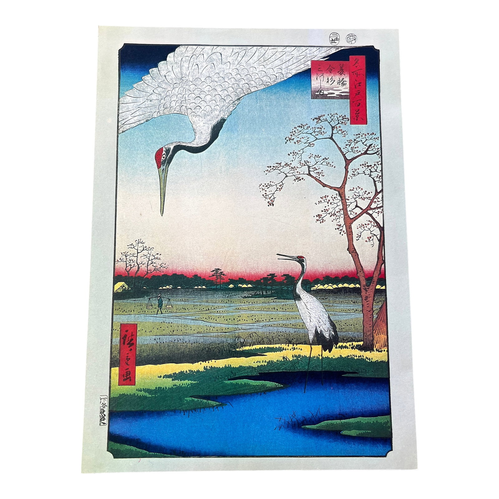 Hiroshige: Minowa, Kanasugi, Mikawashima (Cranes) - Woodblock Reproduction: The Artistry An exquisite hand-pulled woodblock reproduction of Utagawa Hiroshige's "Minowa, Kanasugi, Mikawashima," Plate No. 102 from the One Hundred Famous Views of Edo (1857). This winter scene