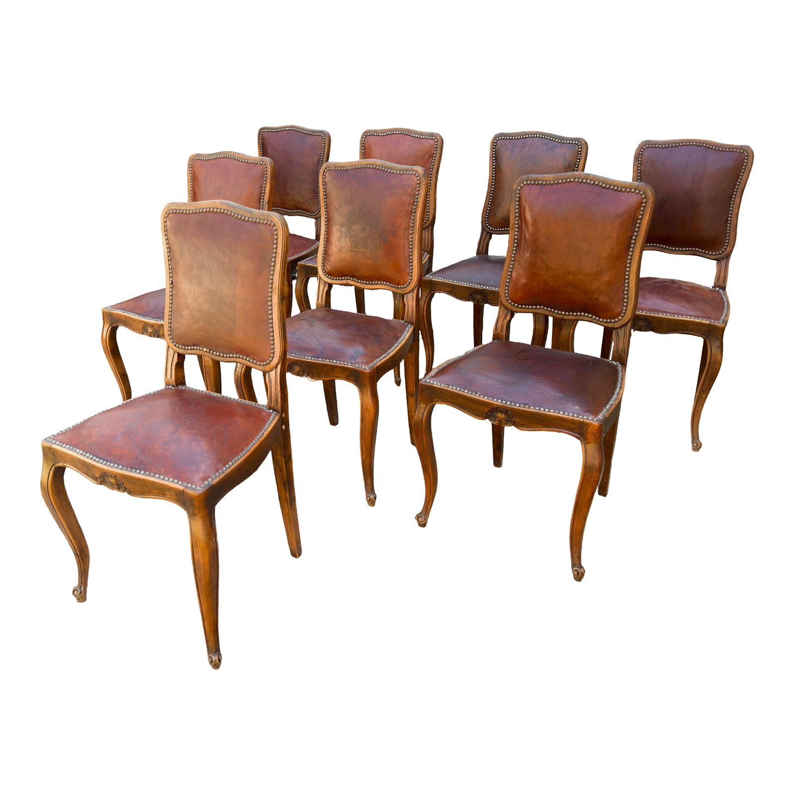 Elegant Set of Eight French Louis XV Antique Dining Chairs From the Late 1800s: Presenting eight Louis XV dining chairs from the late 1800s. These antique chairs feature elegant walnut frames complemented by original leather upholstery. They are designed in the French Provincial 
