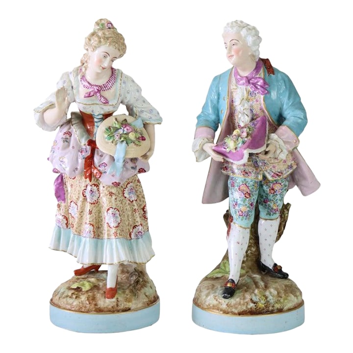 Pair of Large Meissen Style Porcelain Figures of Woman & Man Gardeners C1890: A charming pair of antique porcelain figures, in the manner of Meissen and dating to circa 1890. These finely crafted pieces depict a man and a woman gardener, embodying the pastoral elegance