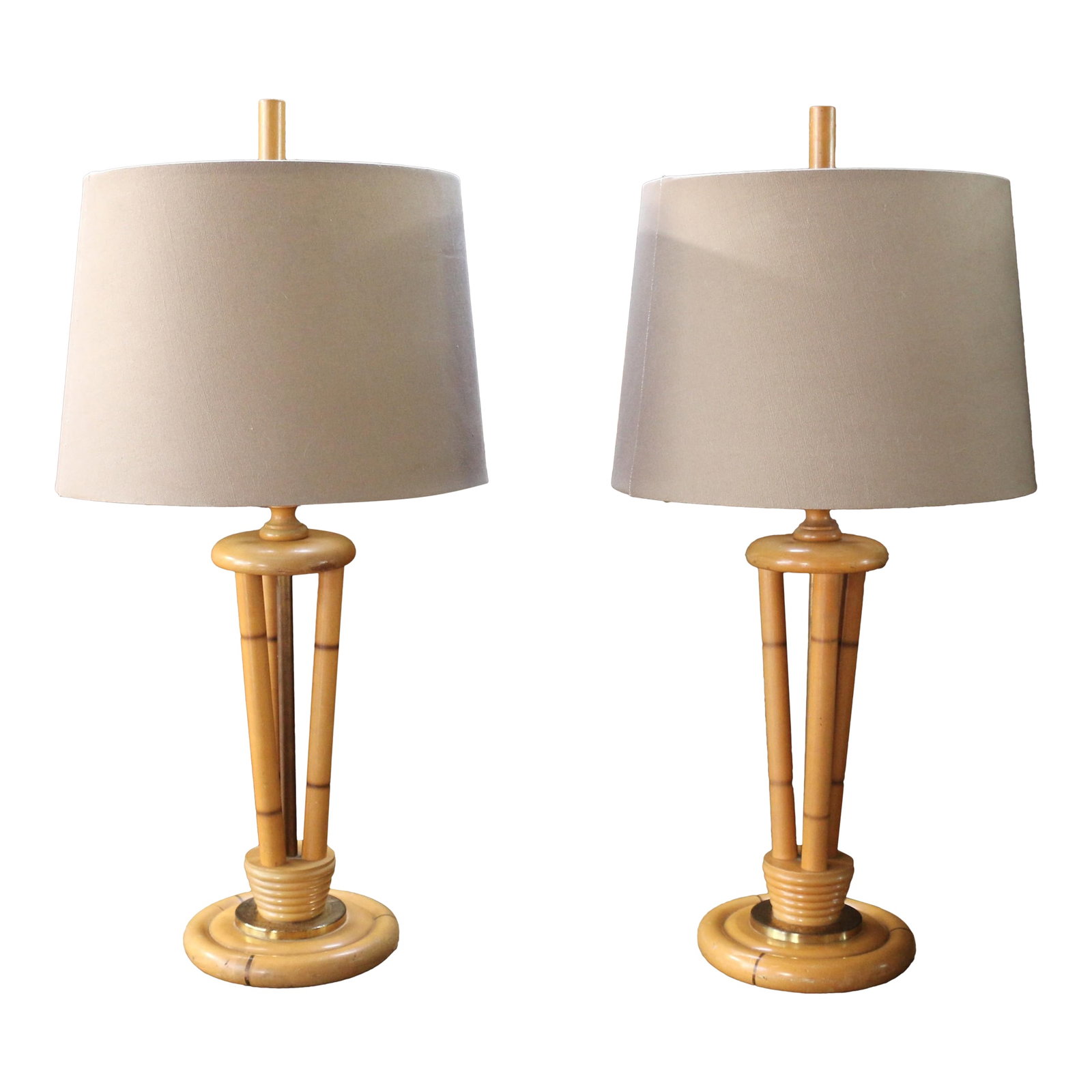 1950s Heywood-Wakefield Bamboo Style Table Lamps | Pair of Mid Century Modern Wood Lamps: Beautiful pair of 1950s Heywood-Wakefield, ( no maker's mark). table lamps featuring elegant triple bamboo-form splayed shafts rising from circular wood bases with gilt metal accents. These lamps embo