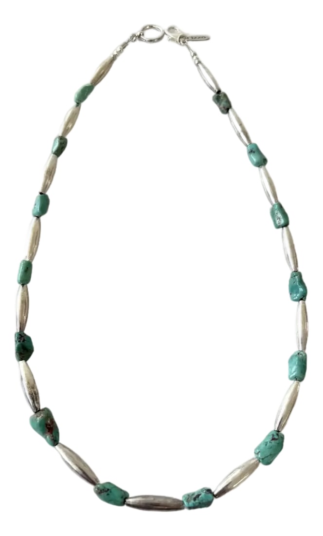Vintage Southwestern Silver Beads and Turquoise Nuggets Necklace by Matthew Izzo: Handmade southwestern or Native American-style jewelry.It features irregularly shaped turquoise nuggets interspersed with polished or elliptical silver beads. Condition: Alterations: Original Conditio