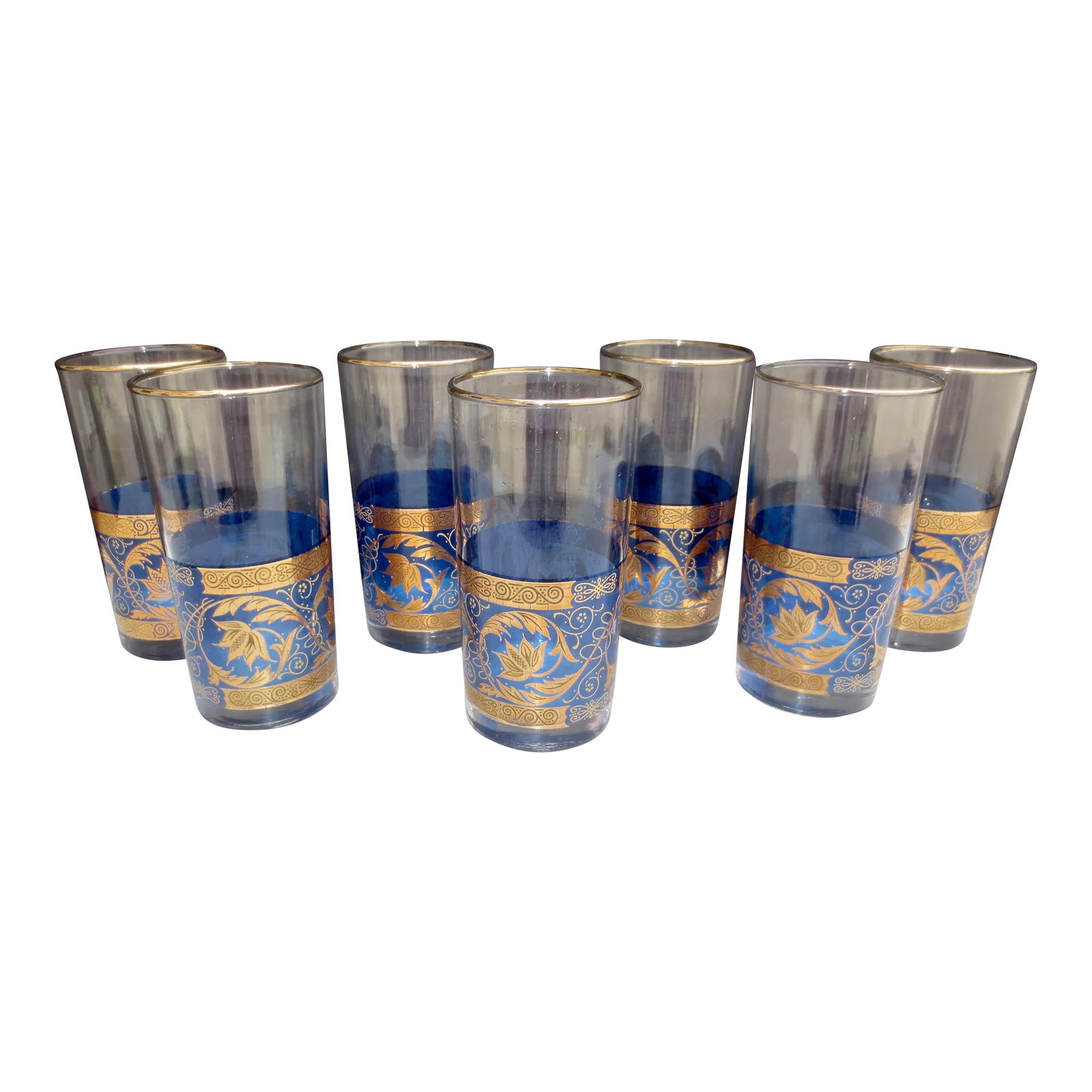 Moroccan Blue and Gold Water Glasses- Set of 7: Vintage 50s Moroccan water glasses, with a blue band with satin gold pattern. Greek design influence of wrapping acanthus leaves and scrolling vines intertwining. Red gold and mirror gloss yellow