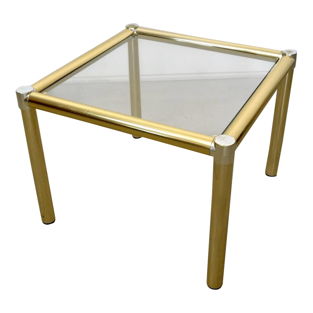 1970's Hollywood Regency Brass Side Table: Vintage Art Deco side table for sale. From the 1970's, and a beautiful accent table. It has a tubular brass frame with chrome accents on the corners, and a glass insert. It's in excellent vintage