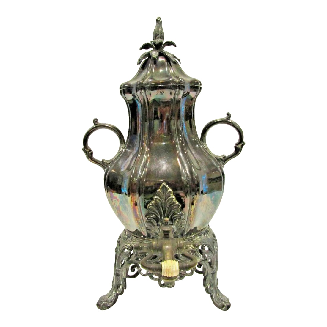 Early 20th Century Silver Plated Floral Pattern Sheffield Style Samovar: Early 20th Century Silver Plated Floral Pattern Sheffield Style Samovar Measures 9 1/2" wide handle to handle, 11" deep spout to leg and 17 3/4" tall. Condition: Alterations: Original Condition