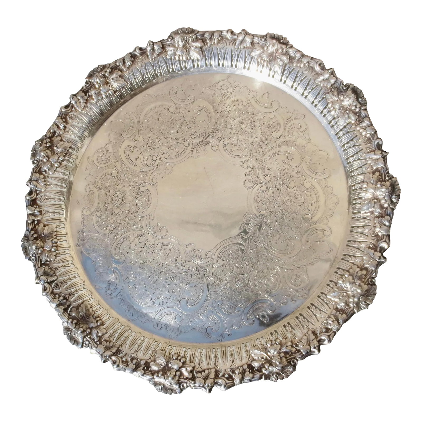 Silver Plated Serving Tray: Silver plate Beaux-arts serving tray. Very high-style in glorious Beaux-arts style. Bordered by clusters of grapes and leaves over an open-cut pierced rim border. The center is covered with an
