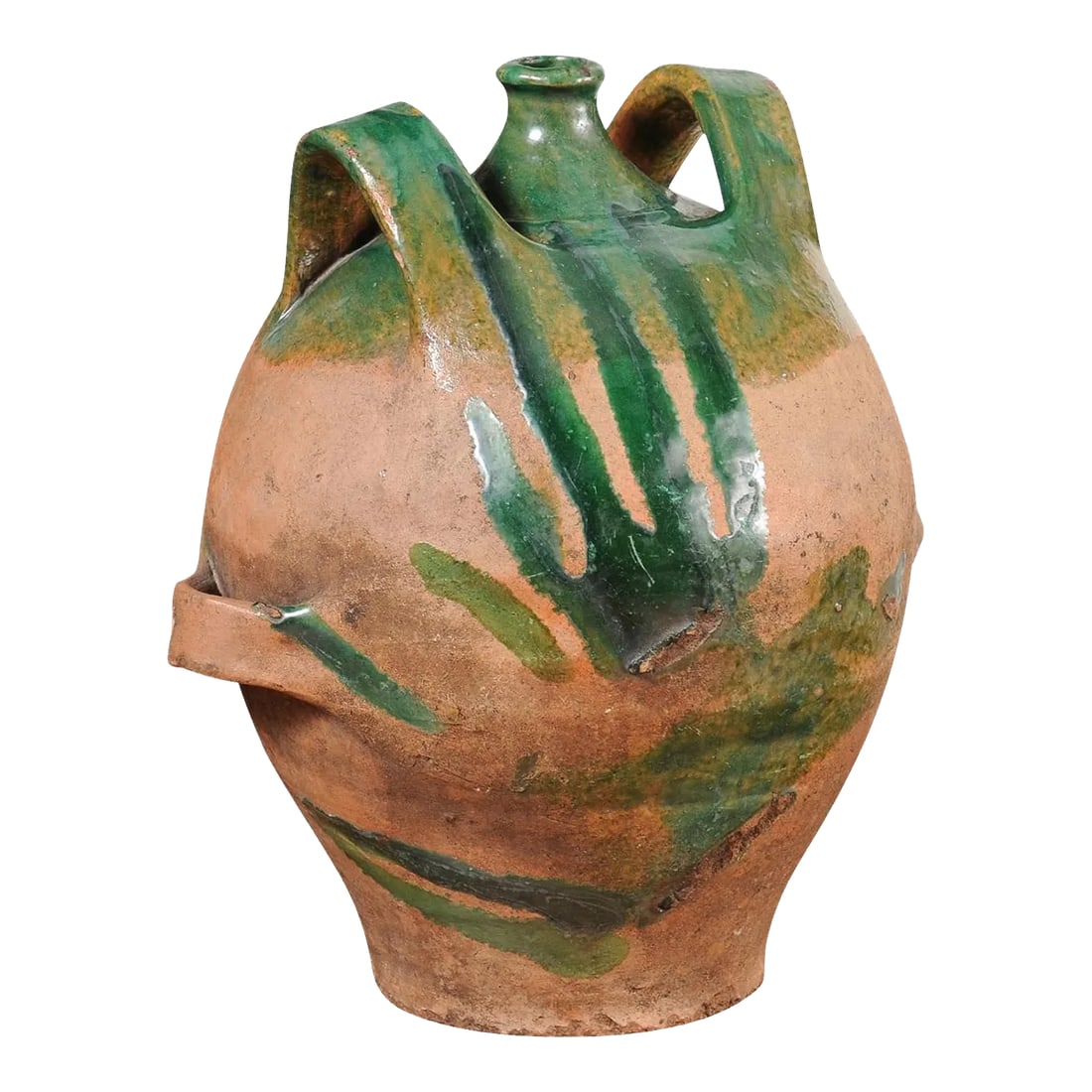 French Provincial 19th Century Green Glazed Pottery Jug with Dual Handles: A French Provincial pottery jug from the 19th century with green glaze, dripping and lateral handles flanking the central spout. This captivating French Provincial pottery jug, crafted with