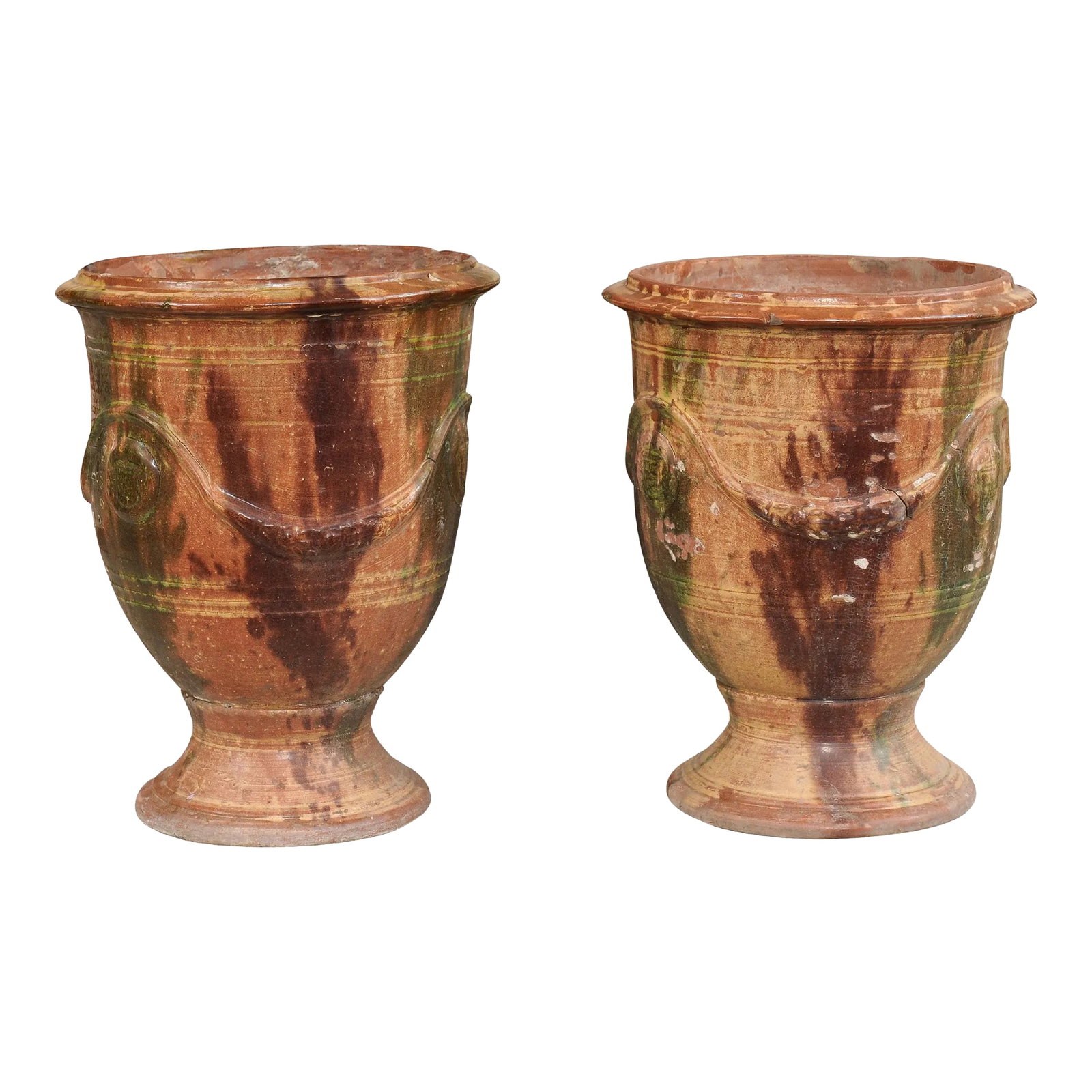 French 19th Century Anduze Jars with Brown and Green Glaze and Swags - A Pair: A pair of French Anduze jars from the 19th century with dark brown and green drip glaze and swag decoration in raised relief. Elevate your outdoor space with this captivating pair of 19th-century