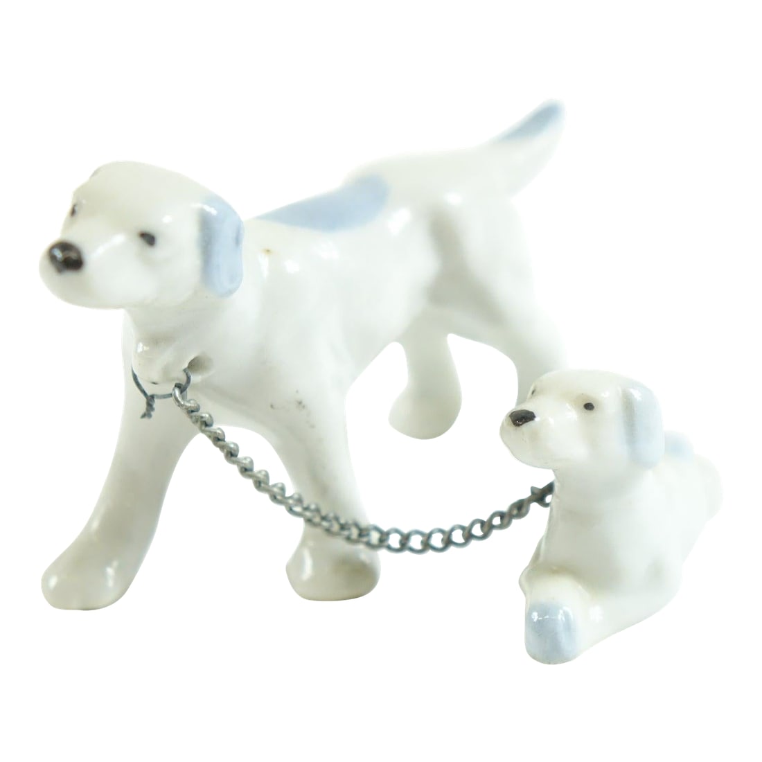 Mid 20th Century Porcelain European Dogs Figurines - A Pair: Pair of Porcelain European Dogs Figurines – 3.5" x 1.5" x 2" Charming and whimsical, this pair of porcelain dog figurines captures the affectionate bond between a parent and puppy. Expertly