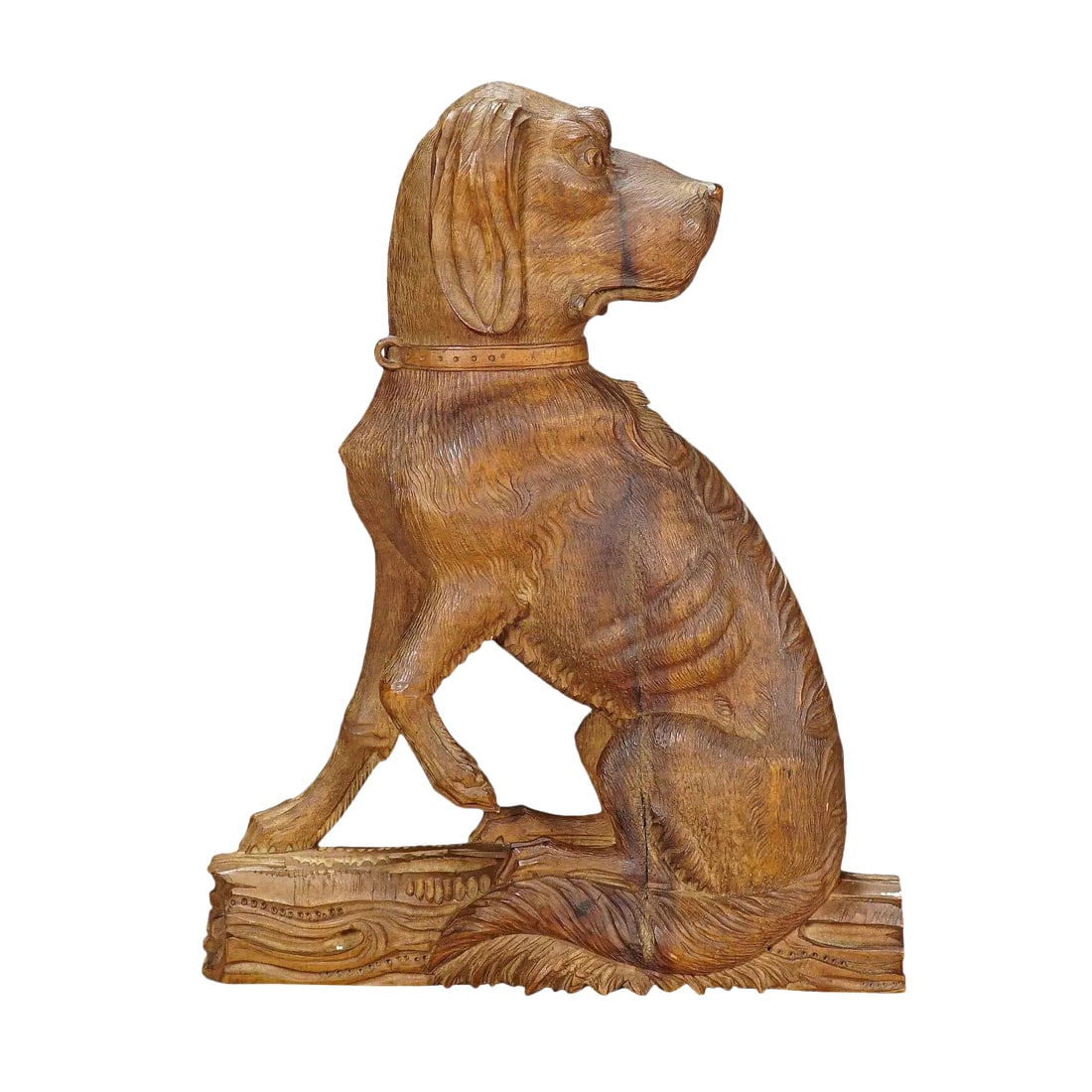 Carved Statue of a Staghound, Circa 1920: Fine Carved Statue of a Staghound, circa 1920 A wooden carved statue of a staghound. It is carved as half relief out of one piece of nutwood. Made in Brienz, Switzerland circa 1920. Measures: Width: